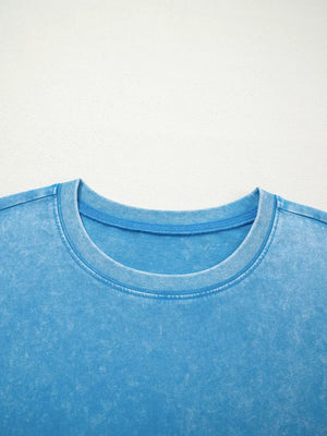 Mineral washed blue cotton crew neck t-shirt with a relaxed fit.