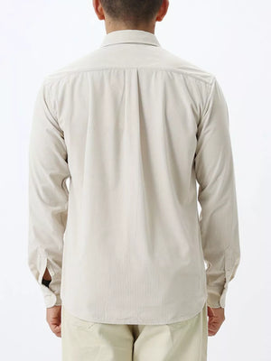 Refined plus size long sleeve shirt in apricot with buttoned cuffs and a classic collar.