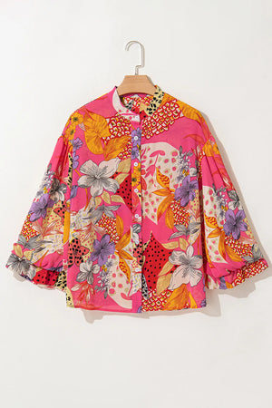 Patchwork floral blouson sleeve blouse in strawberry pink with a band collar and button front.