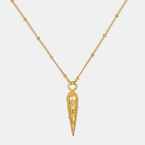 Gold layered necklace with beaded chain and conical pendant featuring celestial charms.