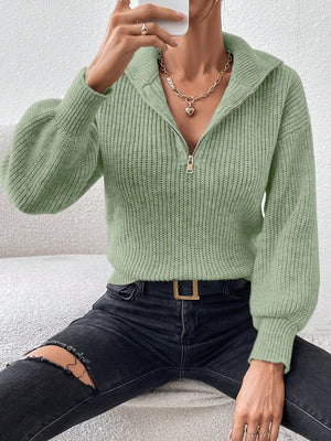 Matcha green ribbed zip-up sweater with a tall collar and balloon sleeves.