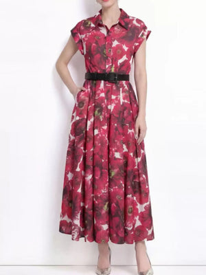 Red botanical print collared midi dress with button-down front and black belt.