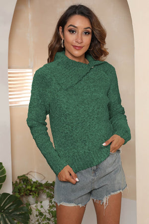 Dark green textured knit sweater with an asymmetric collar and button detail.
