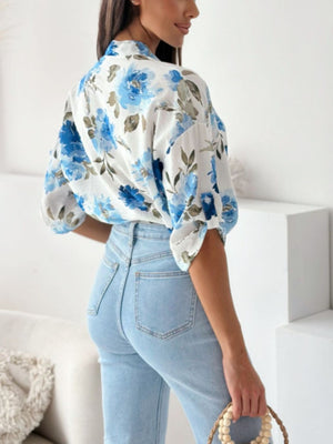 Floral print blouse with mandarin collar in Royal Blue, featuring button details and short sleeves.