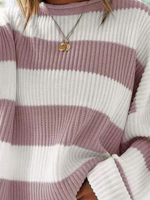 Striped oversized knit sweater in dusty pink and white with a crew neck.