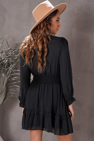 Black ruffled mini dress with smocked waist and long sleeves