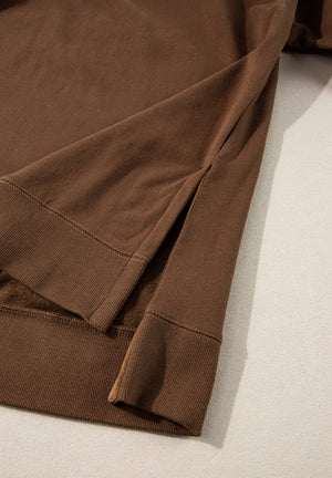 Brown loungewear set with side slits on the hem and ribbed cuffs.