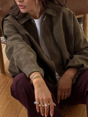 Oversized zip-up jacket in military green with a relaxed fit and collared neckline.