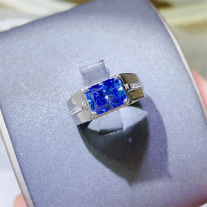Blue emerald cut moissanite signet ring with diamond accents on band