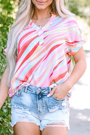 Prismatic stripe henley blouse in blush pink with a v-neck and short sleeves.