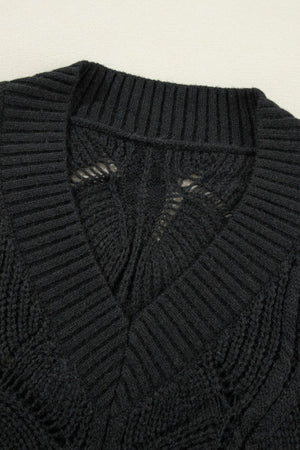 Black openwork knit V-neck pullover sweater with textured stitch details.