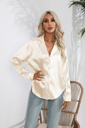 Glossy satin button-down blouse in cream with a relaxed fit and collared neckline.