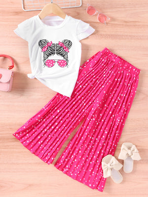 White graphic tee with cartoon girl and pink polka dot pants set.