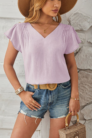 Lilac textured V-neck blouse with pleated flutter sleeves.