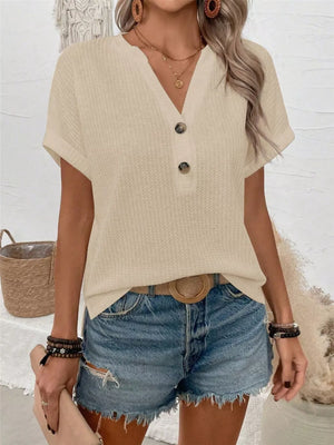 Apricot waffle knit V-neck t-shirt with button detail and cuffed sleeves.