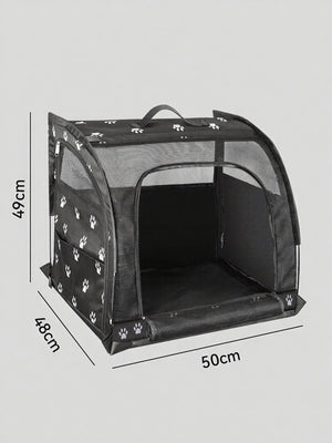 Black pet carrier with white paw print pattern, mesh sides and top, and zippered front opening.