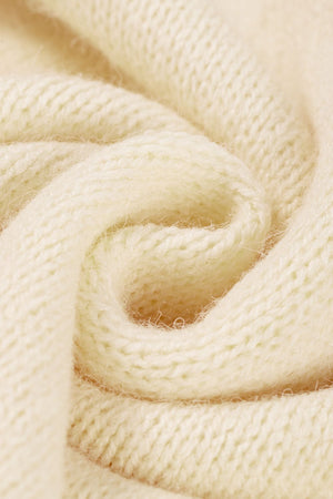 Cream acrylic knit sweater with a textured stitch detail.