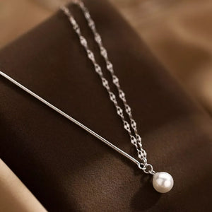 Lustrous pearl pendant layered necklace in 925 sterling silver with delicate chain detail.