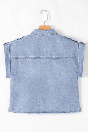 Light blue denim shirt jacket with rolled sleeves and shoulder epaulets.
