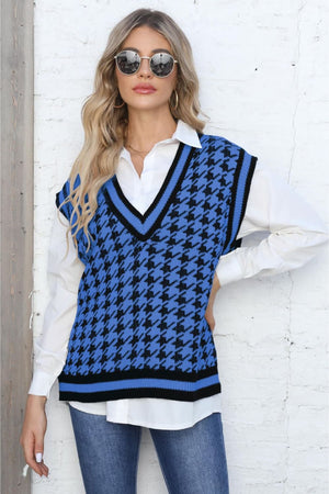 Blue houndstooth knit v-neck vest with black trim, acrylic.