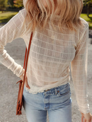 Sheer plaid long-sleeve top in beige with a slim fit and lettuce hem detail.