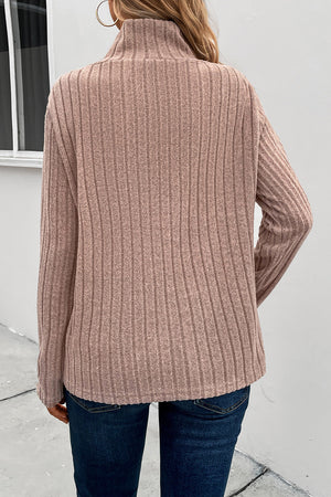 Mocha ribbed knit top with a high neckline and long sleeves.