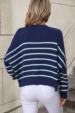 Navy and aqua striped boxy knit sweater with crew neck and relaxed fit.