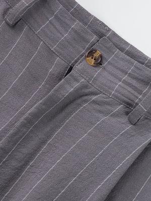Grey striped men's sweatpants with a button closure and textured fabric.
