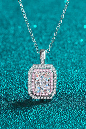 Silver necklace with radiant cut moissanite and pink halo.