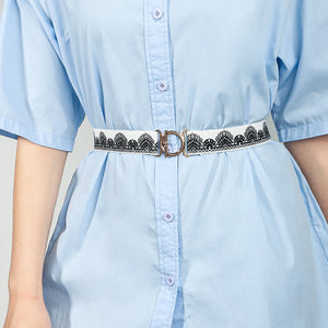 White elastic belt with black lace trim and gold circle buckle