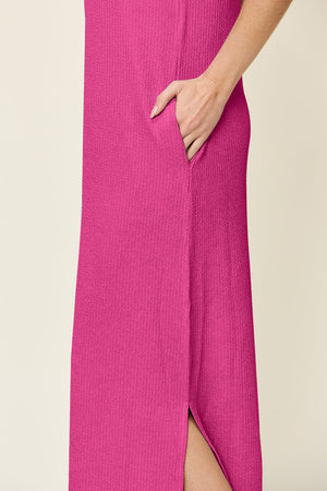Hot pink ribbed maxi dress with side slits and pockets.