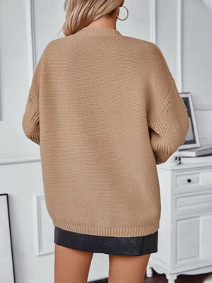 Camel chunky knit cardigan with cable knit detail on sleeves.