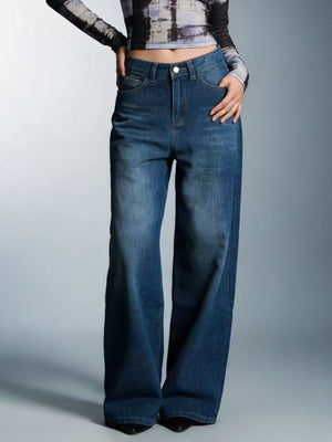 Cutout high-waisted wide-leg jeans in blue denim with button closure.