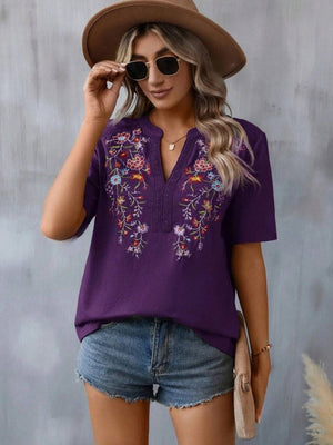Violet embroidered V-neck tunic with crochet trim and short sleeves.