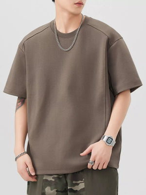 Oversized brown cotton blend t-shirt with crew neck and short sleeves.