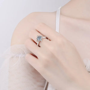 Sterling silver ring with a floral diamond center and sparkling band.
