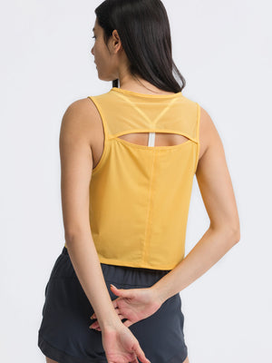 Yellow cropped active tank with mesh back inset and cutout detail