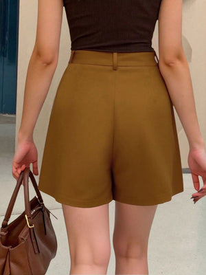 Brown pleated high-waisted shorts with belt loops and pockets.