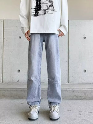 Men's light wash vintage wide-leg jeans with a relaxed fit.