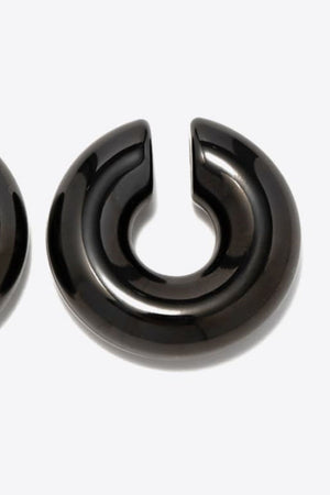 Glossy black crescent cuff earrings, 18K gold-plated, casual accessory.
