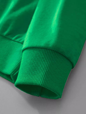 Festive Reindeer Graphic Sweatshirt in dark green, showing ribbed cuff detail.