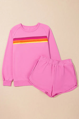 Fuchsia pink loungewear set with retro stripe detail on sweatshirt and elastic waist shorts