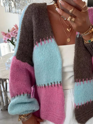 Pastel color block knit cardigan with balloon sleeves and contrast stitching.