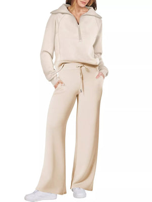 Beige half zip lounge set with wide leg pants and a collared sweatshirt.