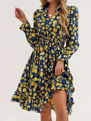 Blue floral smocked dress with v-neck and ruffled hem