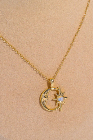 Gold celestial crescent moon and starburst necklace with opal detail
