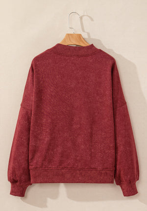 Acid wash mock neck sweatshirt in deep red with ribbed cuffs and hem.