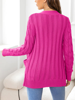 Hot Pink cable-knit cardigan with pockets and ribbed texture.