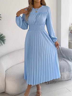 Light blue midi dress with long sleeves, ruffled neckline, and smocked waist.