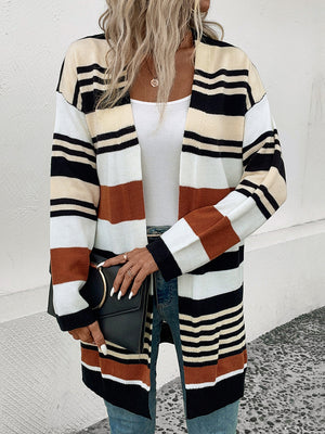 Bold stripe knit duster cardigan with burnt orange, black, white, and cream stripes.